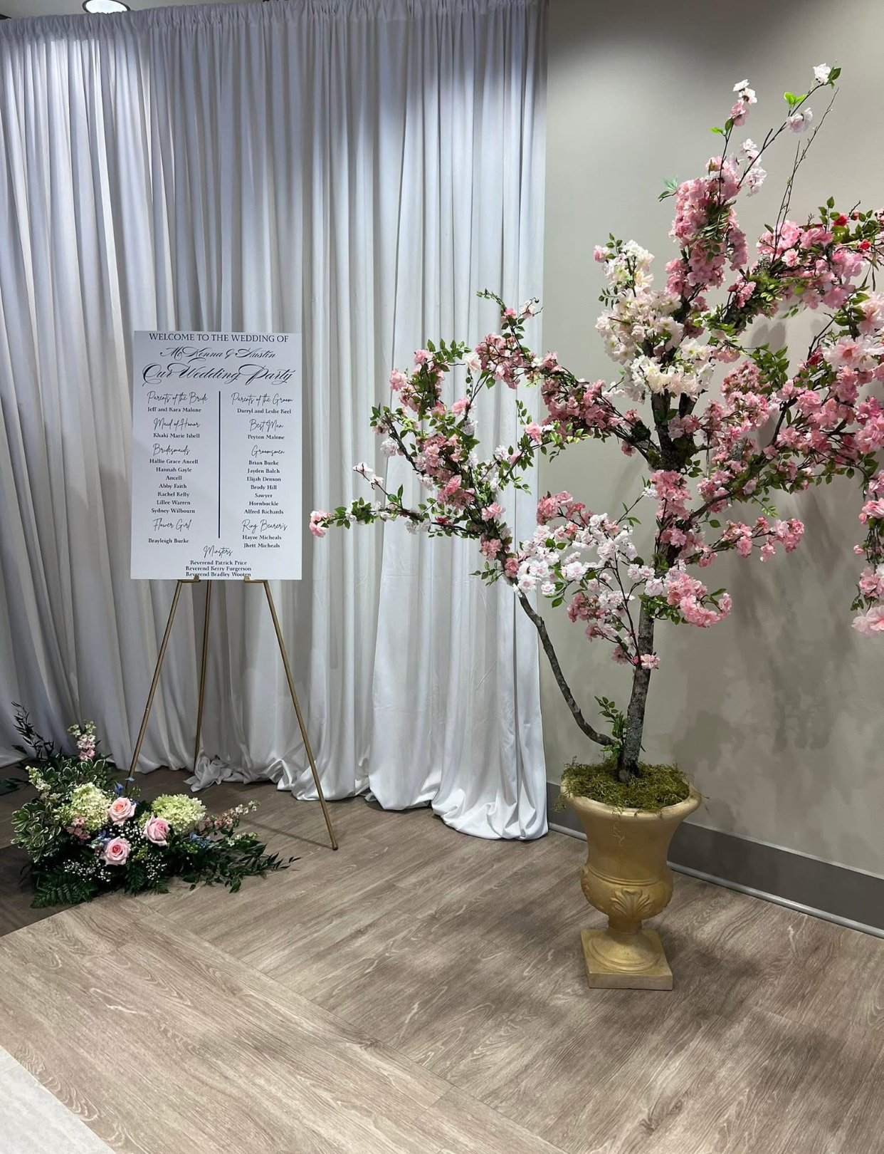 cherry blossom tree by wedding welcome sign