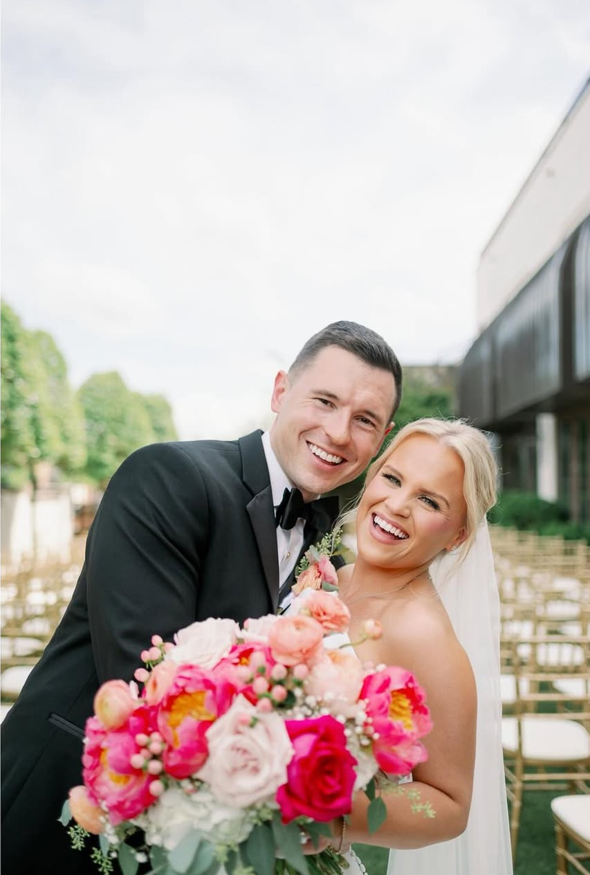 bride and groom laughing and embracing