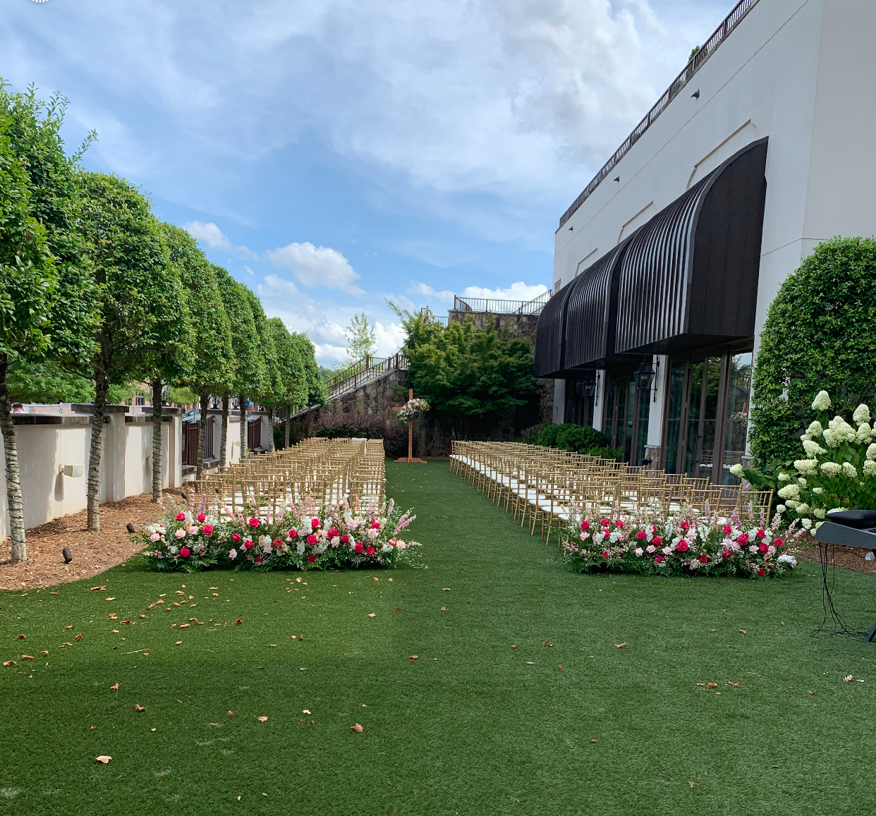 wedding ceremony flowers along aisle
