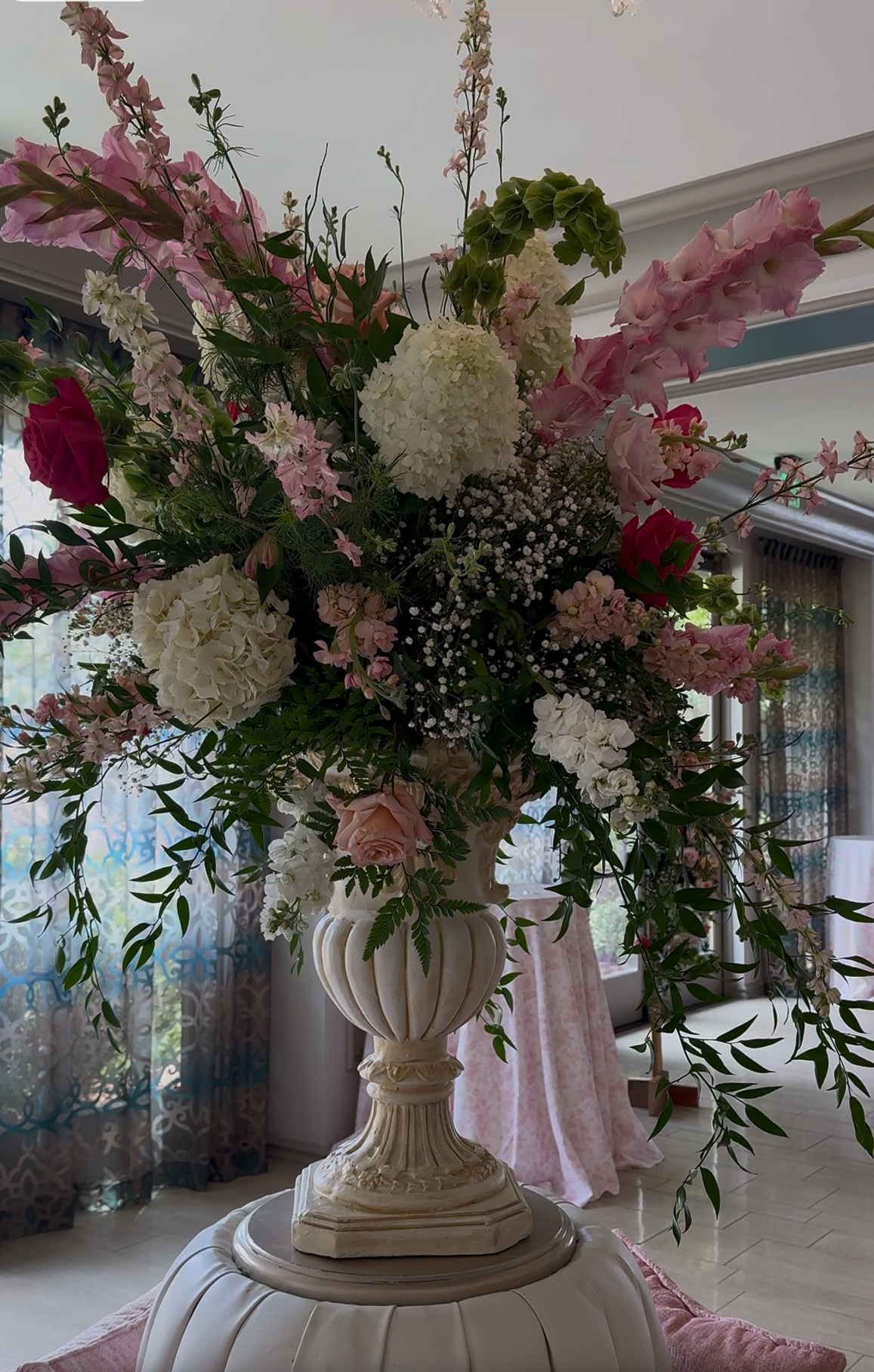tall pink and white floral arrangement